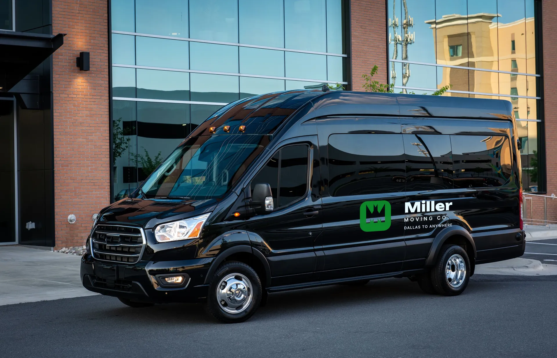 Miller Moving Co. logo on black executive van