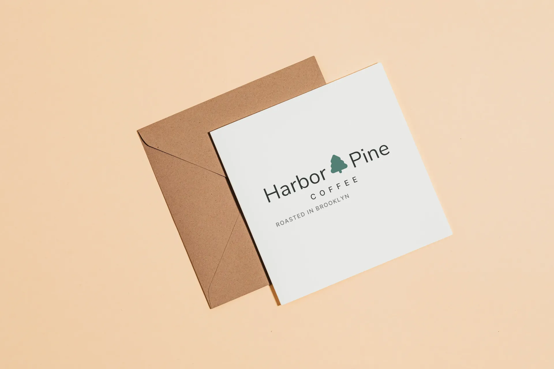 Harbor & Pine Coffee logo on card on a kraft envelope