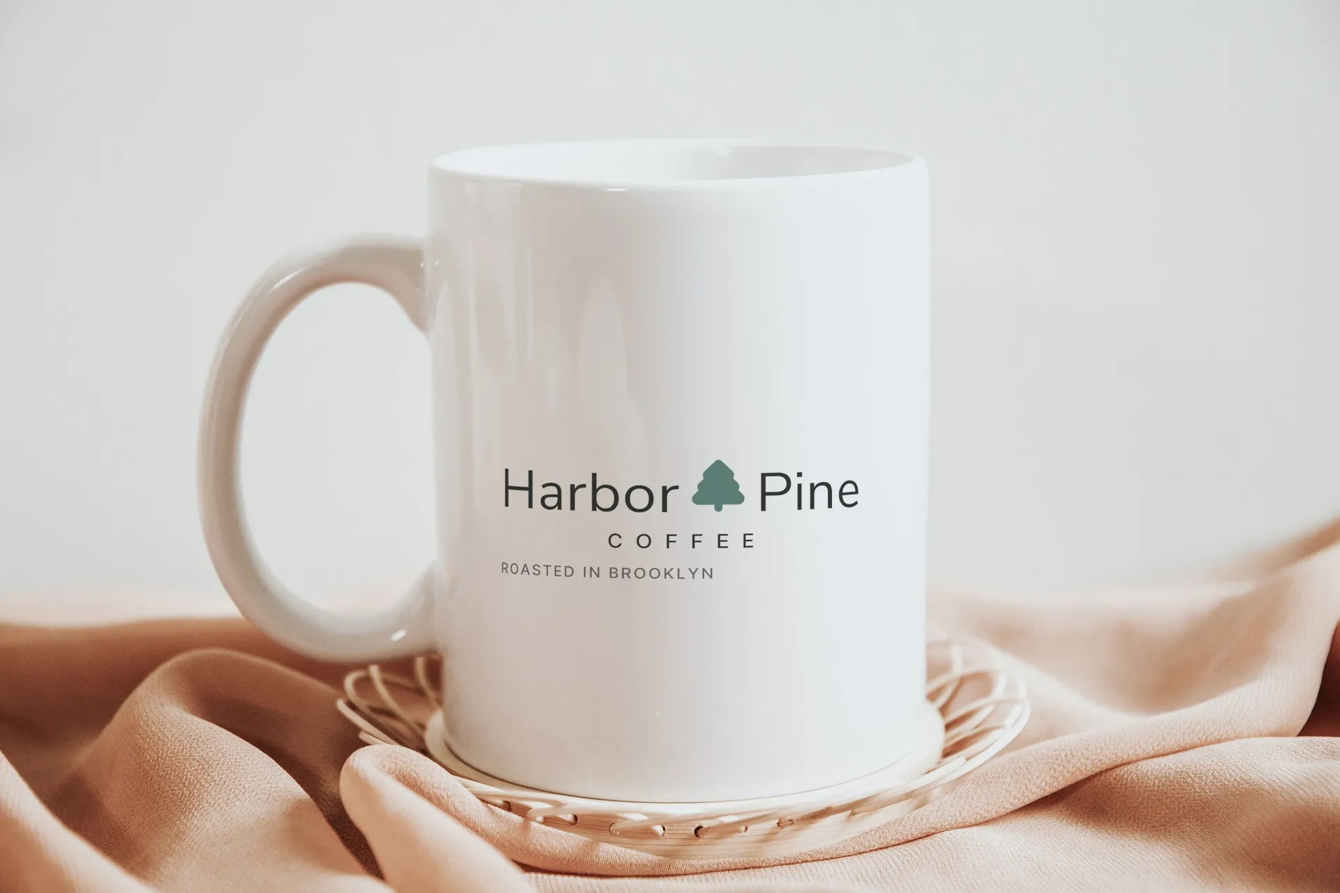 Harbor & Pine Coffee logo on ceramic mug on silk